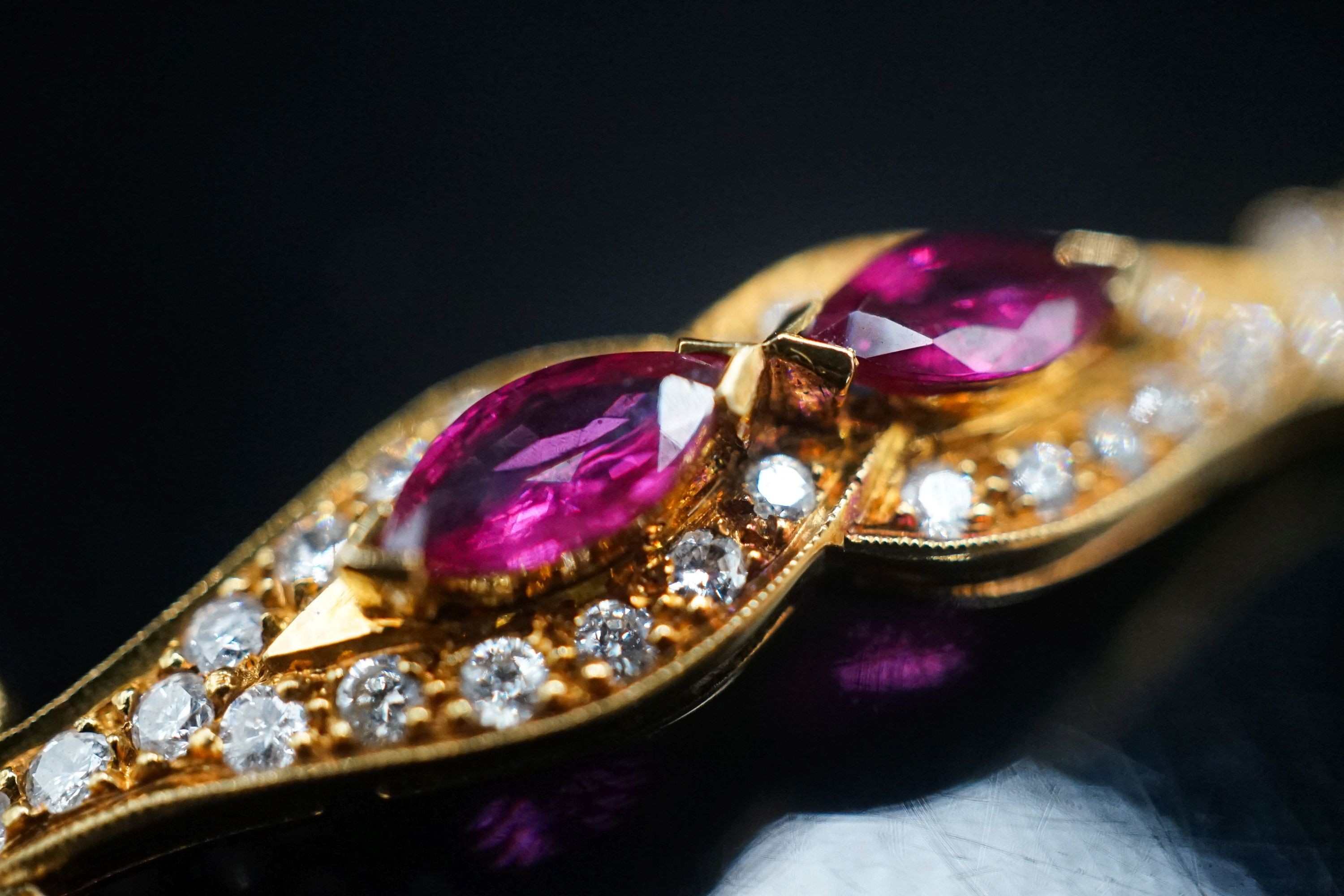 A lady's modern 18k, ruby and diamond set bracelet, 16cm, gross weight 9.2 grams.